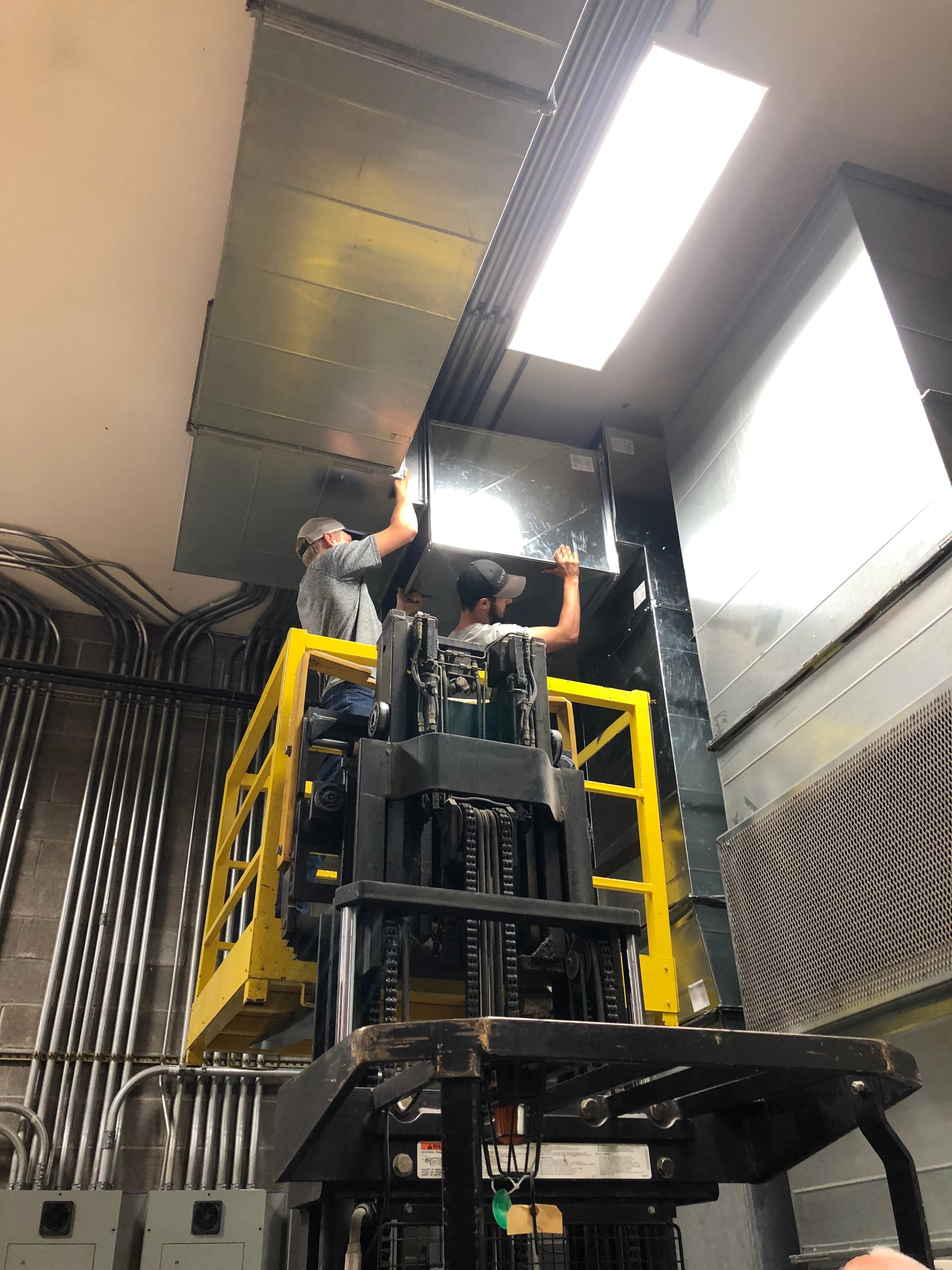 C&M Mechanical Team putting in heating system